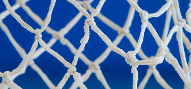 istock Empty Swooshing Basketball Net Close Up with blue Background 1131886265