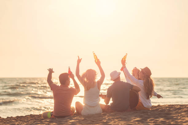 istock Group of friends on the beach enjoy 1131886297