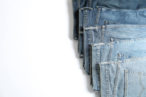 istock Jeans of different colors isolated on white background, space for text 1131886447
