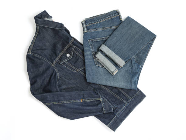 istock Folded denim jacket and jeans on white background 1131886697