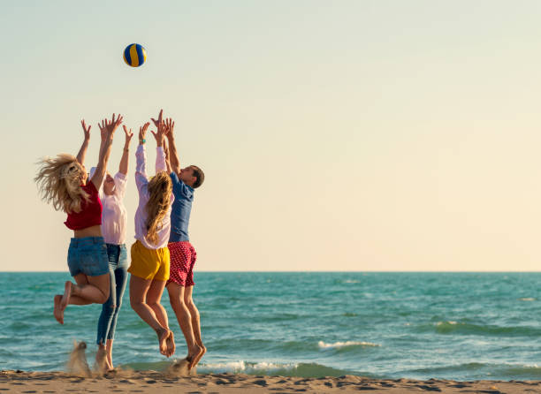 istock Group of friends on the beach enjoy 1131887721