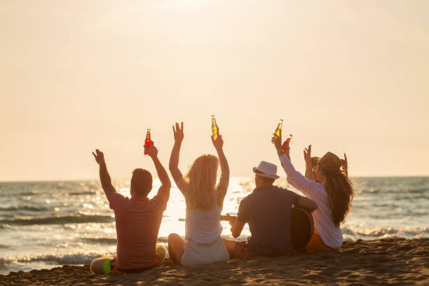 istock Group of friends on the beach enjoy 1131887900