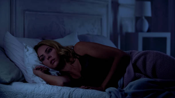 istock Worried woman cannot sleep at night, thinking about life difficulties, stress 1131888748