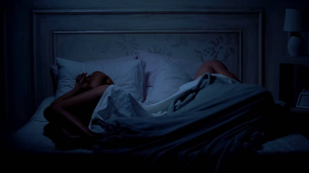 istock Couple sleeping in bed, lying apart, relations difficulties, quarreling concept 1131889234