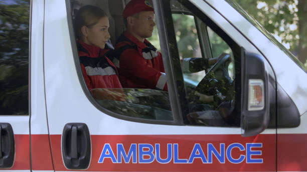 istock Emergency workers sitting in car, driving to emergency call-out, first aid 1131889374