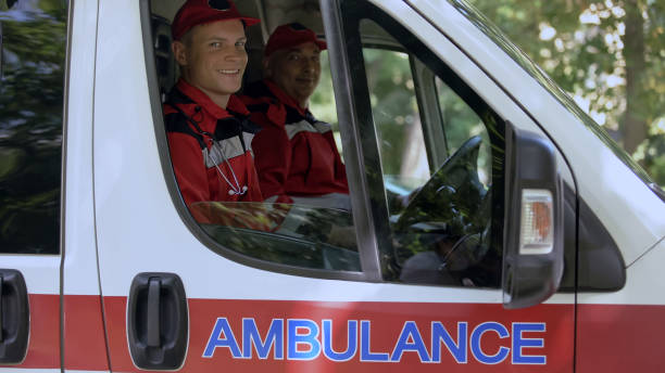istock Friendly doctors in ambulance looking at camera, professional emergency service 1131889400