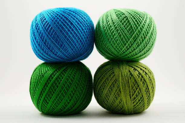 istock four skeins of wool on a white background 1131889507