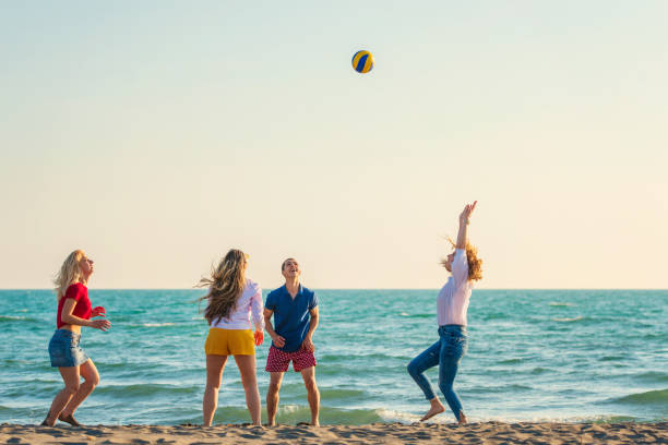 istock Group of friends on the beach enjoy 1131890303