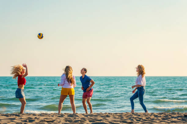 istock Group of friends on the beach enjoy 1131890530