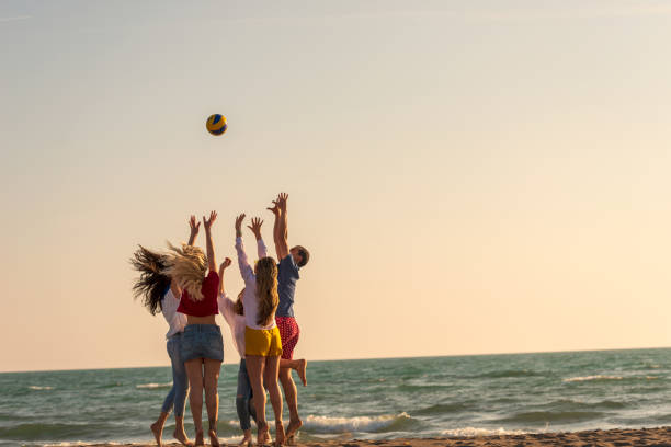 istock Group of friends on the beach enjoy 1131891633