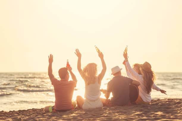 istock Group of friends on the beach enjoy 1131893234