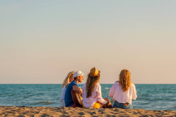 istock Group of friends on the beach enjoy 1131893281
