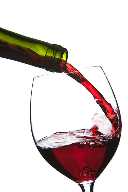 istock red wine pouring into glass isolated 113189380