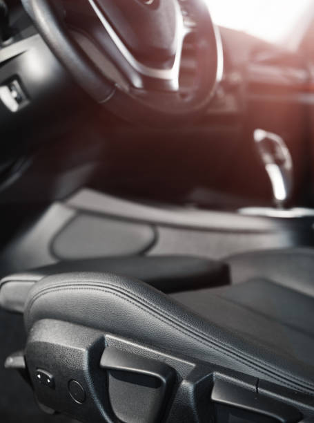 istock Dark luxury car Interior. steering wheel, shift lever and dashboard. 1131894336