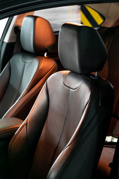 istock Dark luxury new car Interior. Back passenger seats in modern car, side view. 1131894347