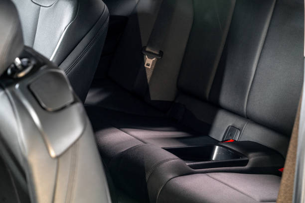 istock Dark luxury new car Interior. Back passenger seats in modern car, side view. 1131894351