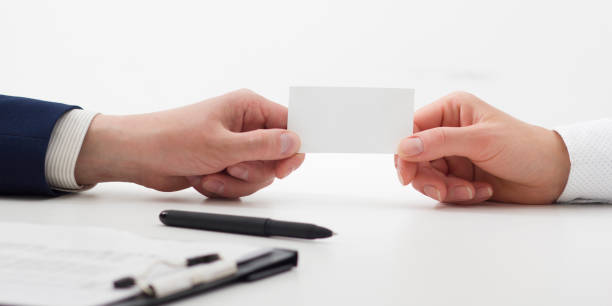 istock business executive exchanging business card blank 1131895712