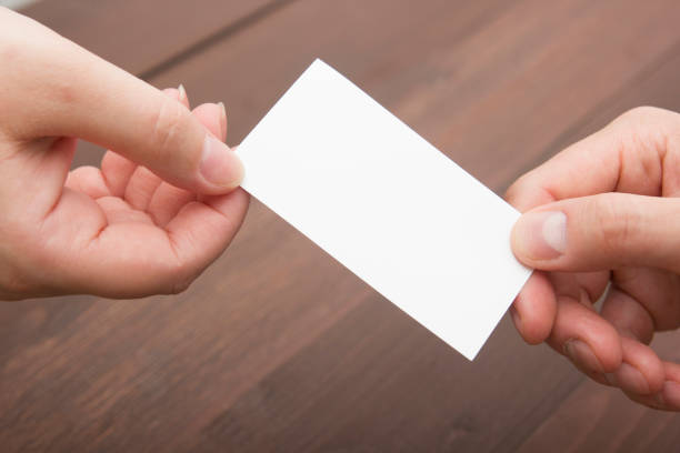 istock business executive exchanging business card blank 1131895729