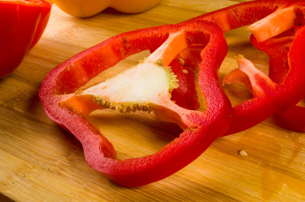 istock sliced fresh red paprika, bell pepper on bamboo cutting board 1131899488