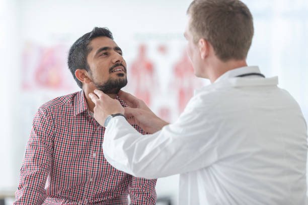 istock Male patient having a throat examination 1131900562