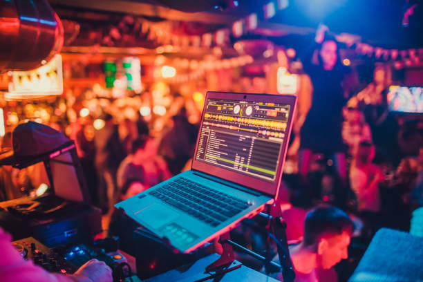 istock DJ mixing tracks on a mixer in a nightclub. 1131901096