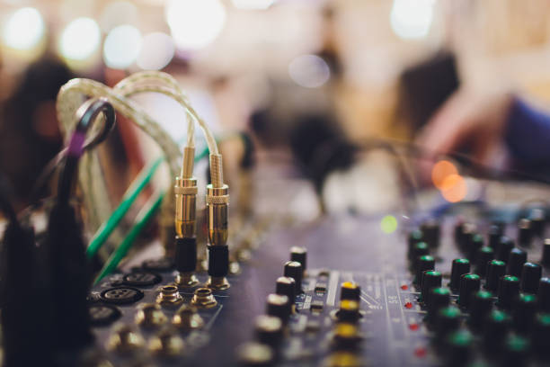 istock professional sound engineering console with buttons to control the quality and sound level. 1131901114