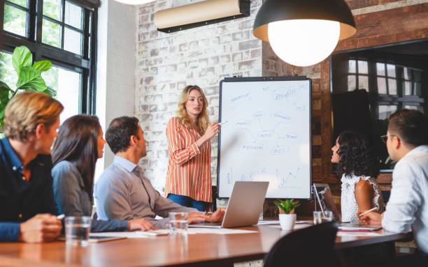 istock Business people watching a presentation on the whiteboard. 1131902851