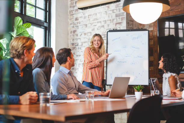 istock Business people watching a presentation on the whiteboard. 1131902853