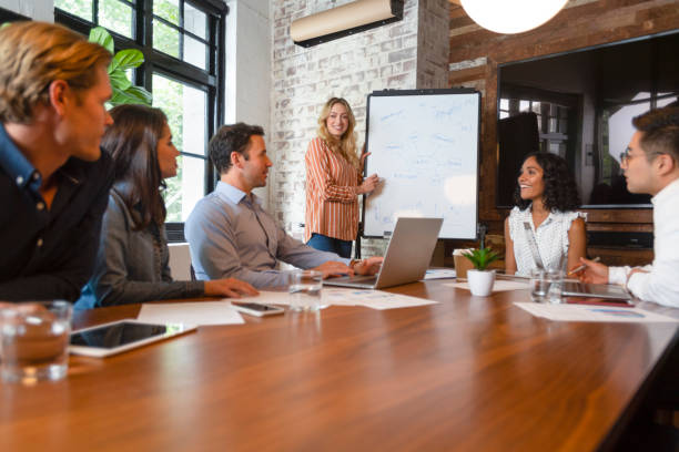 istock Business people watching a presentation on the whiteboard. 1131902861