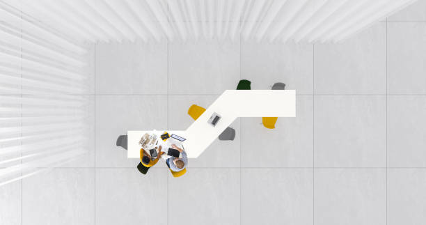 Overhead view of two people at work