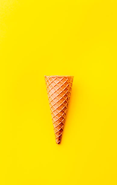 istock Cone for ice Creame on yellow background. Topv view. Minimalistic concept 1131906681