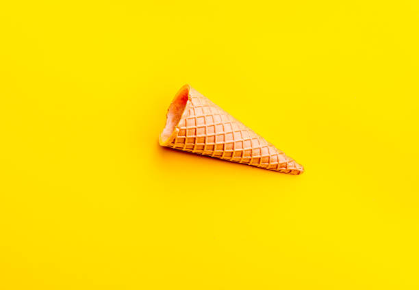 istock Cone for ice Creame on yellow background. Topv view. Minimalistic concept 1131906684