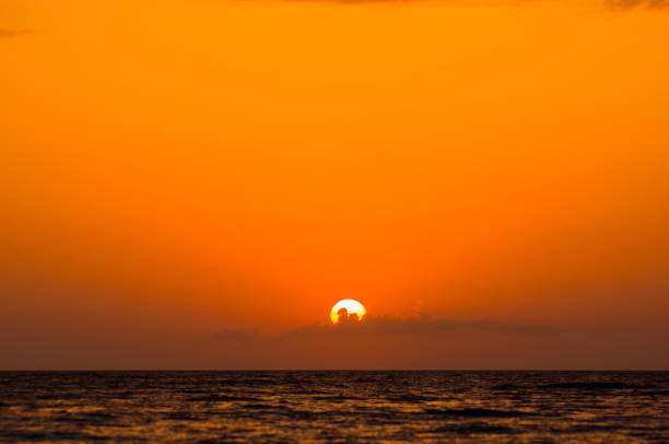 istock Amazing sea sunset on the pebble beach, the sun, waves, clouds 1131906804