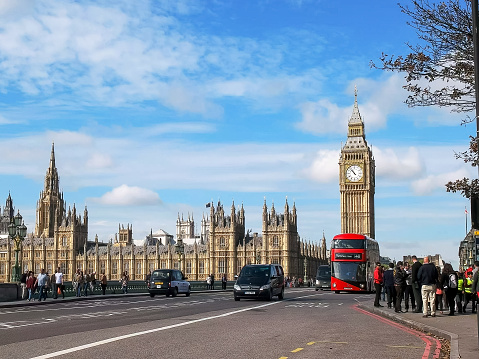 LONDON, ENGLAND, UK - SEPTEMBER 17, 2015: a double decker bus with big ben in london, United Kingdom