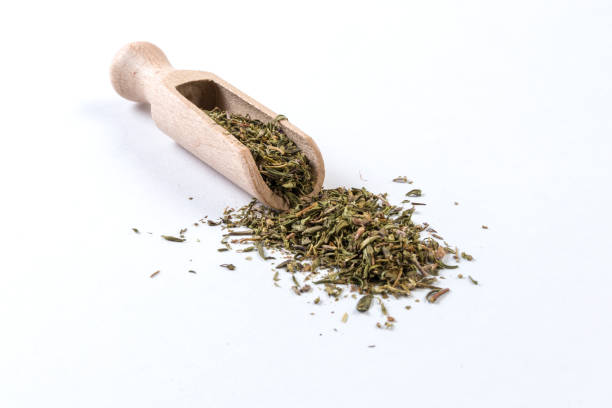 istock thyme herb in wooden scoop isolated on white background 1131917176