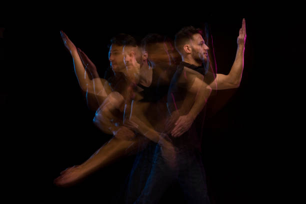 istock Good looking man in a black shirt dancing 1131917819