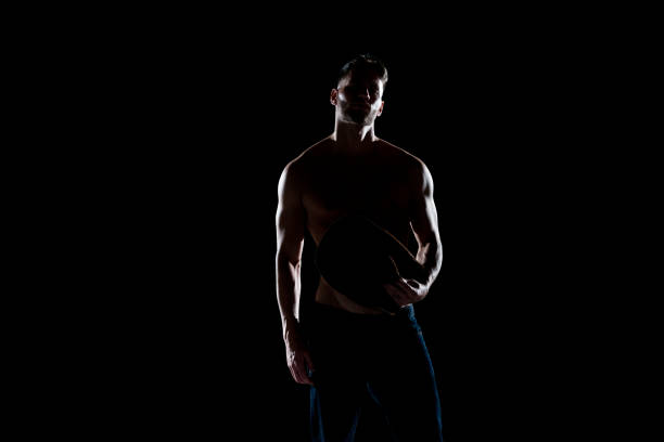 istock Sexy shirtless cowboy with back lighting 1131918011
