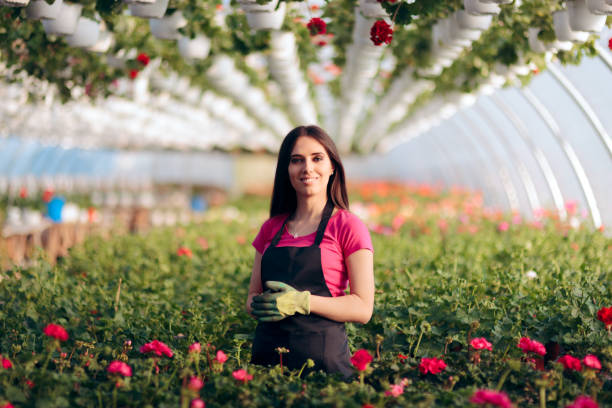 istock Female Entrepreneur Flower Greenhouse Worker 1131919337