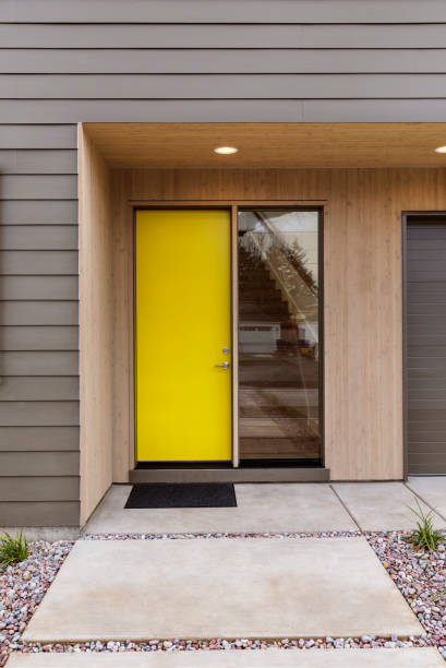 istock Yellow Front door of a modern house 1131921226