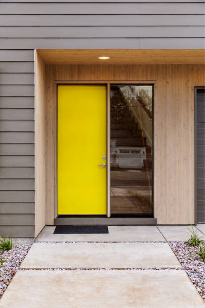 Yellow Front door of a modern house stock photo