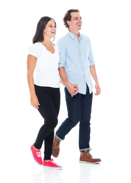 istock Happy couple walking and holding hands 1131922629