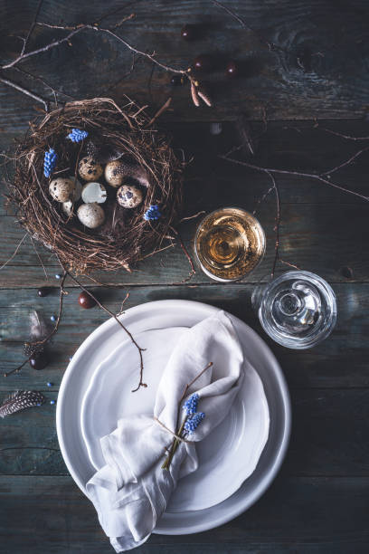 istock Table decoration for Easter with eggs, plates, cutlery, bird's nest. Happy Easter 1131925346