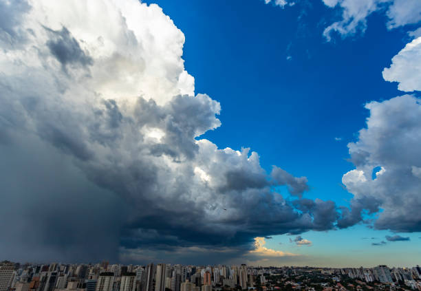 istock Dark and dramatic clouds of rain. Airplane taking off with storm clouds. Very heavy rain sky in the city of Sao Paulo, Brazil South America. 1131925698