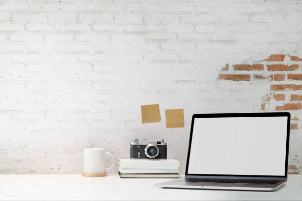 istock Mockup blank screen laptop with white brick wall 1131931579
