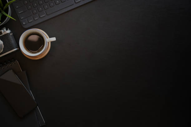 istock Dark leather desk minimal photographer workspace, Top view shot 1131931664