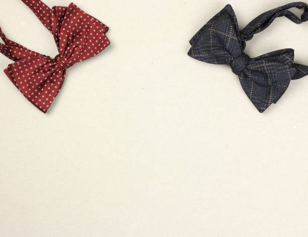 istock two vintage stylish bow ties on cardboard background, postcard for congratulatory texts for holidays, top view, copy space 1131933399