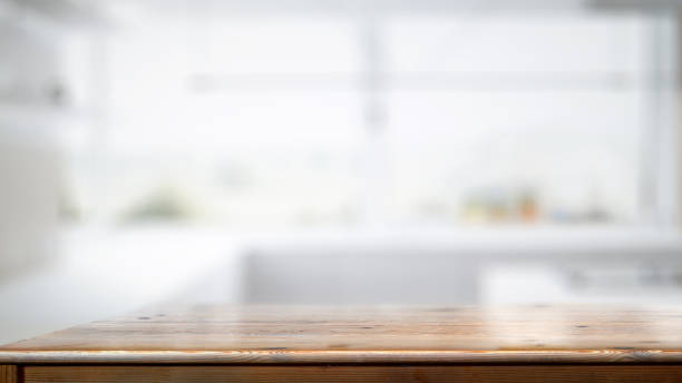 istock Empty wood counter table in white kitchen room background. 1131933423