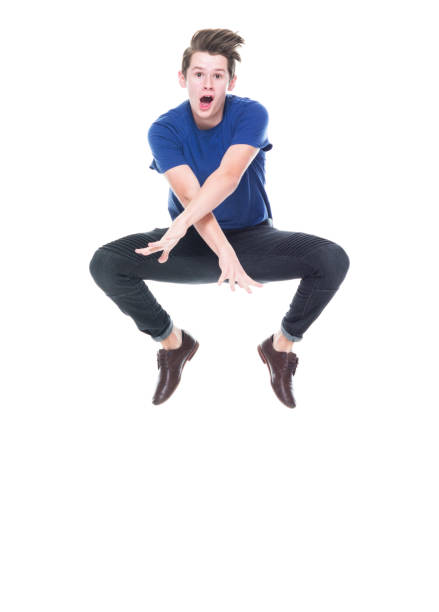 istock Young high school age male jumping 1131933569