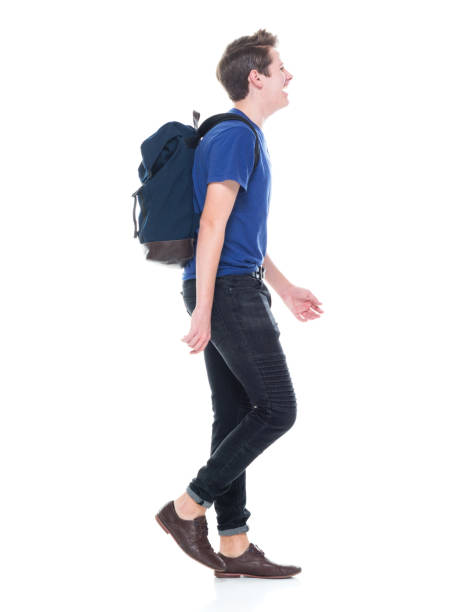 istock Young high school age male student walking 1131933589