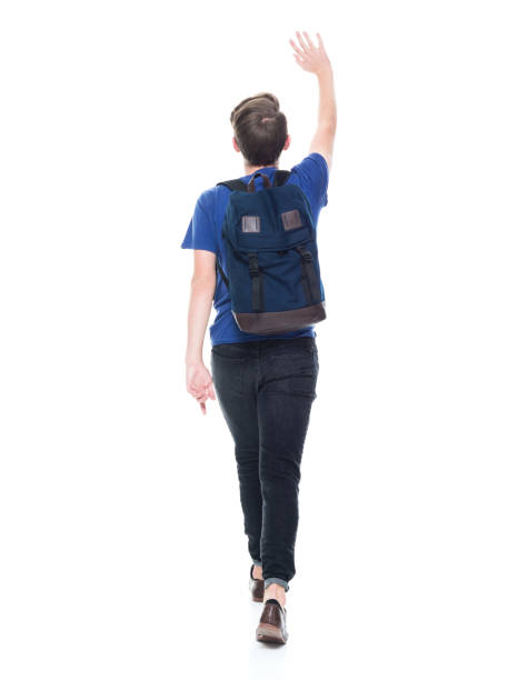 istock Young high school age male student is waving 1131933715